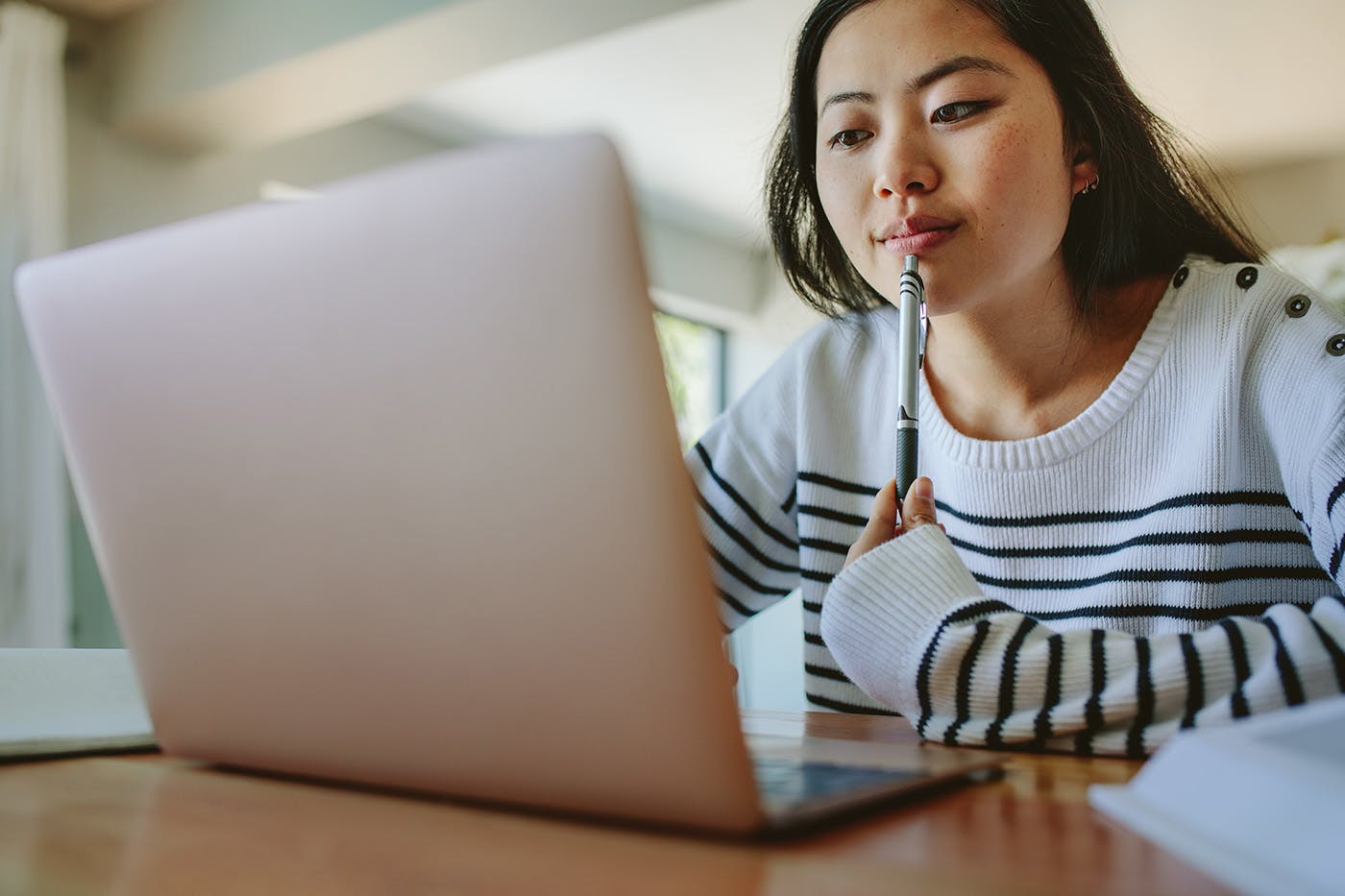 A prospective student researching online community college options